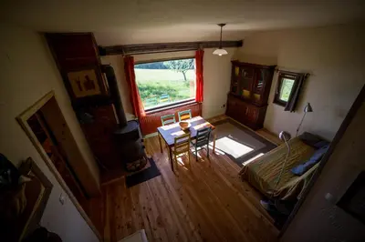an overhead view of a living room with a table and a window at Razborca in Mislinja