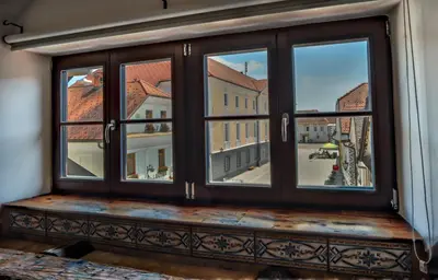 a window with a view of a city at Hiša Linhart, Hotel & Restaurant in Radovljica