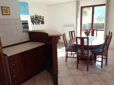 a kitchen and dining room with a table and chairs at Pri Mlinarju in Tolmin