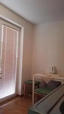 a dining room with a table and a window at Apartments Bernarda in Bled