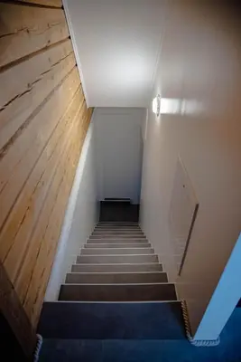 a stairway with a stair case in a building at ALPEART BOHINJ HOLIDAY units in Bohinj