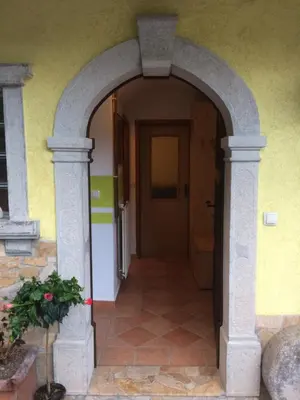 an entrance to a house with an archway at Apartma Gracner in Bled