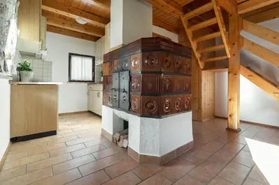 a kitchen with a woodburning stove in a room at Holiday Homes Sara in Bled
