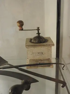 a glass table with an old fashioned telephone on display at Karst Stone Cottage in Štanjel