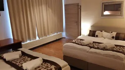 a hotel room with two beds in a room at Yellow Dreamhouse in Postojna