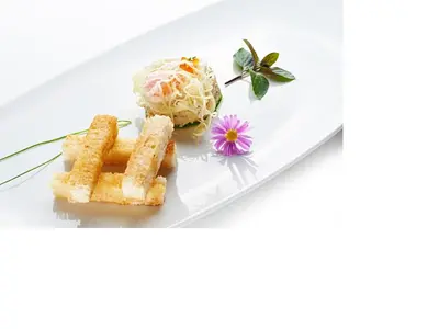 a plate of food with waffles and a flower at Hotel Korosica in Šentjanž pri Dravogradu