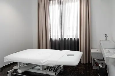 a hospital bed in a room with a window at Boutique Hotel Grahor in Sežana