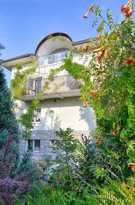 a building with plants on the side of it at Apartments GreenSLO in Ljubljana