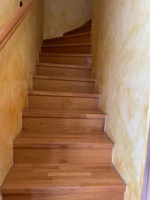 a staircase in a house with wooden floors at Apartma Jelenček in Moravske Toplice
