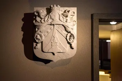 a statue of a woman with a crown on a wall at Villa EVA in Dobrovo
