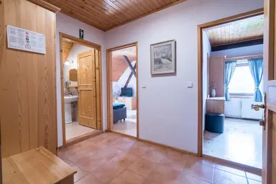 a hallway with a door leading to a bathroom at Mountain View Apartments - Pr` Potovcn`k in Dovje