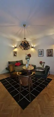 a living room with a couch and a table at Apartment Stella Danica in Čatež ob Savi