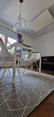 a dining room with a glass table and chairs at Apartment Stella Danica in Čatež ob Savi