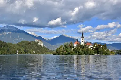 a church on an island in the middle of a lake at Apartment Ravnik in Bled