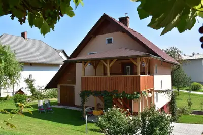 a house with a gambrel roof at Apartment Ravnik in Bled