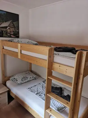 a couple of bunk beds in a room at House Čeh in Črni Kal
