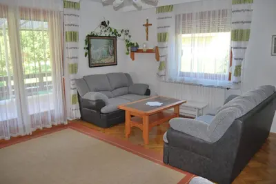 a living room with two couches and a table at Apartment Stefelin in Kamna Gorica