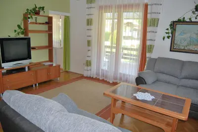a living room with a couch and a coffee table at Apartment Stefelin in Kamna Gorica
