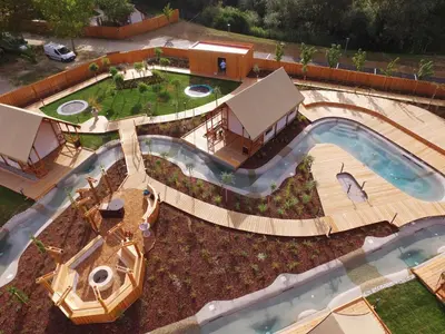 an overhead view of a swimming pool with a backyard at Glamping Olimia Adria village in Podčetrtek
