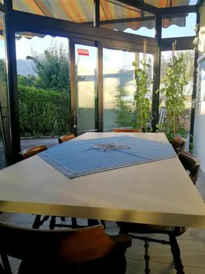 a table with a blue cloth on top of it at Apartma AS in Lesce