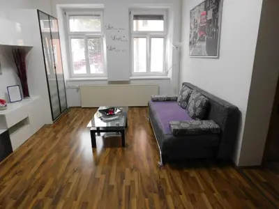 a living room with a couch and a coffee table at CityApartment-Maribor in Maribor