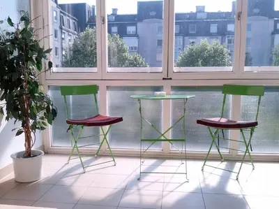 three chairs and a table in front of a window at Studio Apartment Bor Tour As Ljubljana in Ljubljana