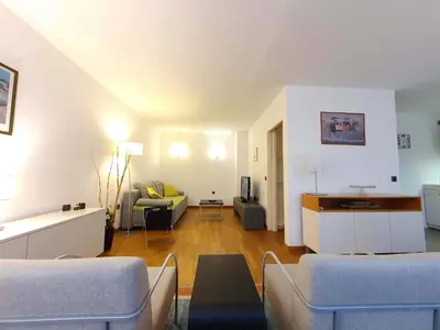 a living room with a couch and a table at Apartment Eva Tour As Ljubljana in Ljubljana