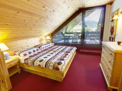 a bedroom with a bed and a window in a room at Apartments Orazem in Bled