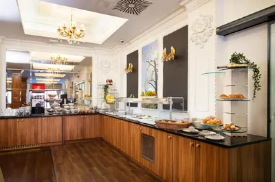 a restaurant with a counter with food on it at Casino & Hotel ADMIRAL Skofije in Zgornje Škofije