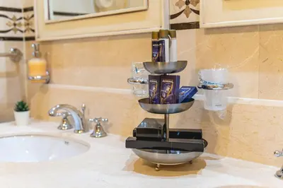 a kitchen counter with a sink with a bowl on it at Casino & Hotel ADMIRAL Skofije in Zgornje Škofije