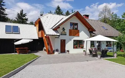 a house with a porch and a patio at PR`Cajhn in Radovljica