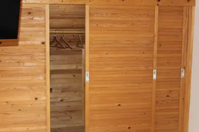 a wooden closet with wood paneling at Holiday Home Winzerhaus Eva in Špičnik