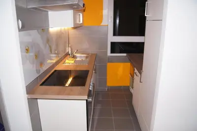 a small kitchen with a sink and a counter at Domas RD Apartment in Ljubljana
