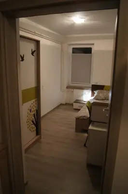 a room with a bedroom and a bed and a window at Domas RD Apartment in Ljubljana