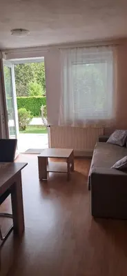 a living room with a couch and a coffee table at Alpes in Radovljica