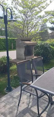 a table with a bench and a table with a fire hydrant at Alpes in Radovljica