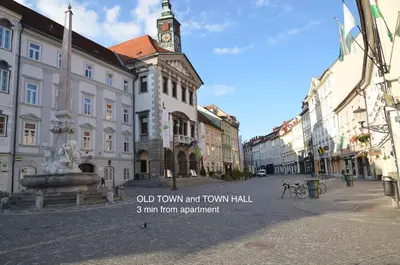 an old town art town hall with a clock tower at i Design Apartment in Ljubljana