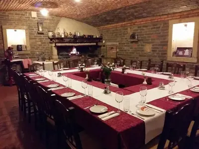 a long table in a large room with red table cloth at Farm stay File in Slope