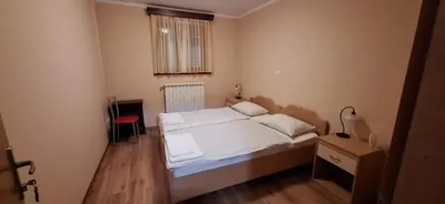 a small bedroom with a bed and a window at Farm stay File in Slope