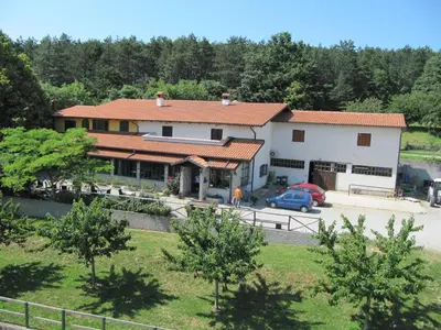 a house with a car parked in front of it at Farm stay File in Slope