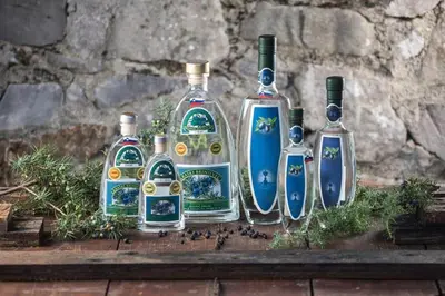 a group of four glass bottles sitting on a table at Farm stay File in Slope