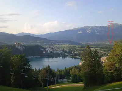 a view of a lake with mountains in the background at Apartment Mojca near Bled in Zabreznica