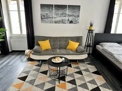 a living room with a couch and a table at Apartment Tina in Bovec