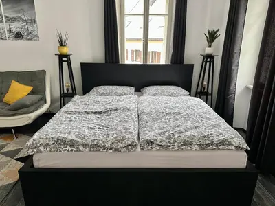 a bedroom with a bed with a black headboard at Apartment Tina in Bovec
