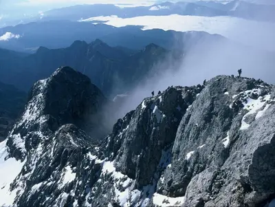 a group of people on the top of a mountain at Apartments Pikon in Bohinj