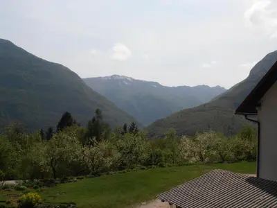 a view of the mountains from a house at Apartment Vida in Bovec