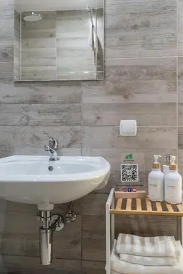 a bathroom with a sink and a mirror at Mountain view Glamping in Dovje