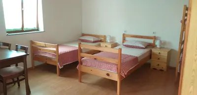 a bedroom with two bunk beds and a desk at Apartment Beautiful Črni Kal in Črni Kal
