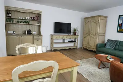 a living room with a table and a couch at Holiday Lake in Bled