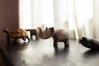 a wooden toy elephant and a tortoise on a table at Large Two Bedroom Family APP - free parking in Ljubljana